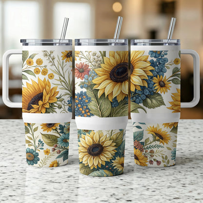 Three tumblers with a botanical sunflower and floral pattern and white handles.